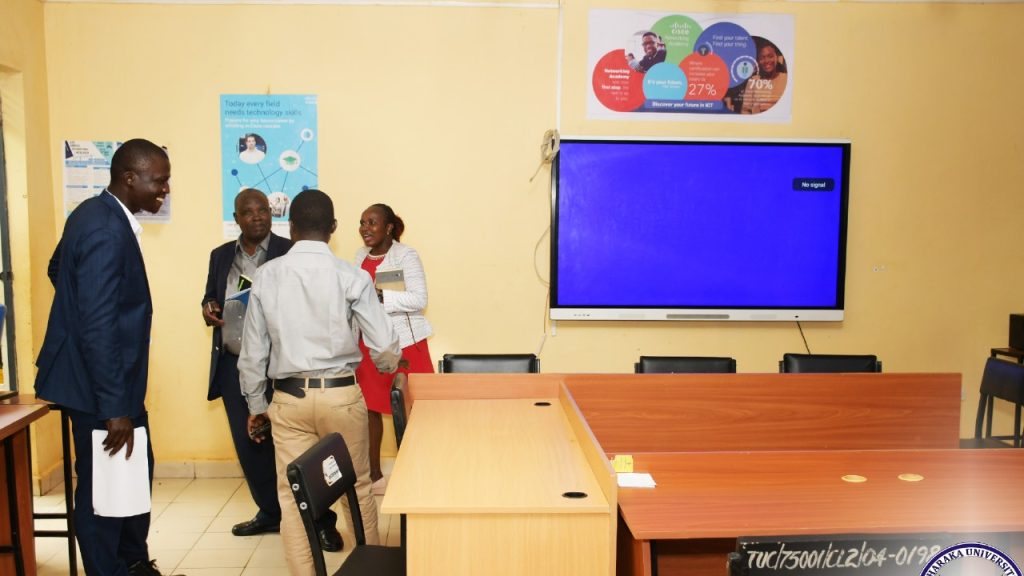 Commission for University Education (CUE) officials assessing the learning resource center